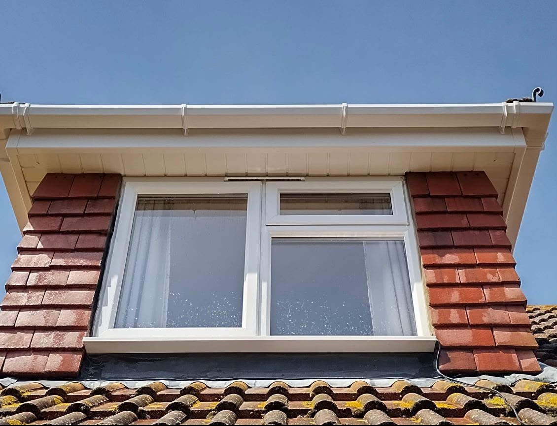 Clean dormer window and white UPVC frames after window cleaning in Lymington