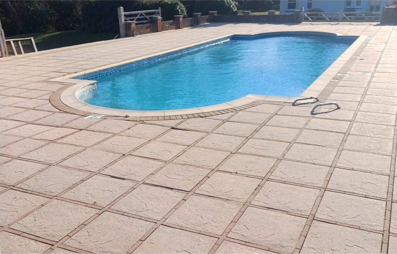 Pool surround patio jet washing before and after in Lymington - after