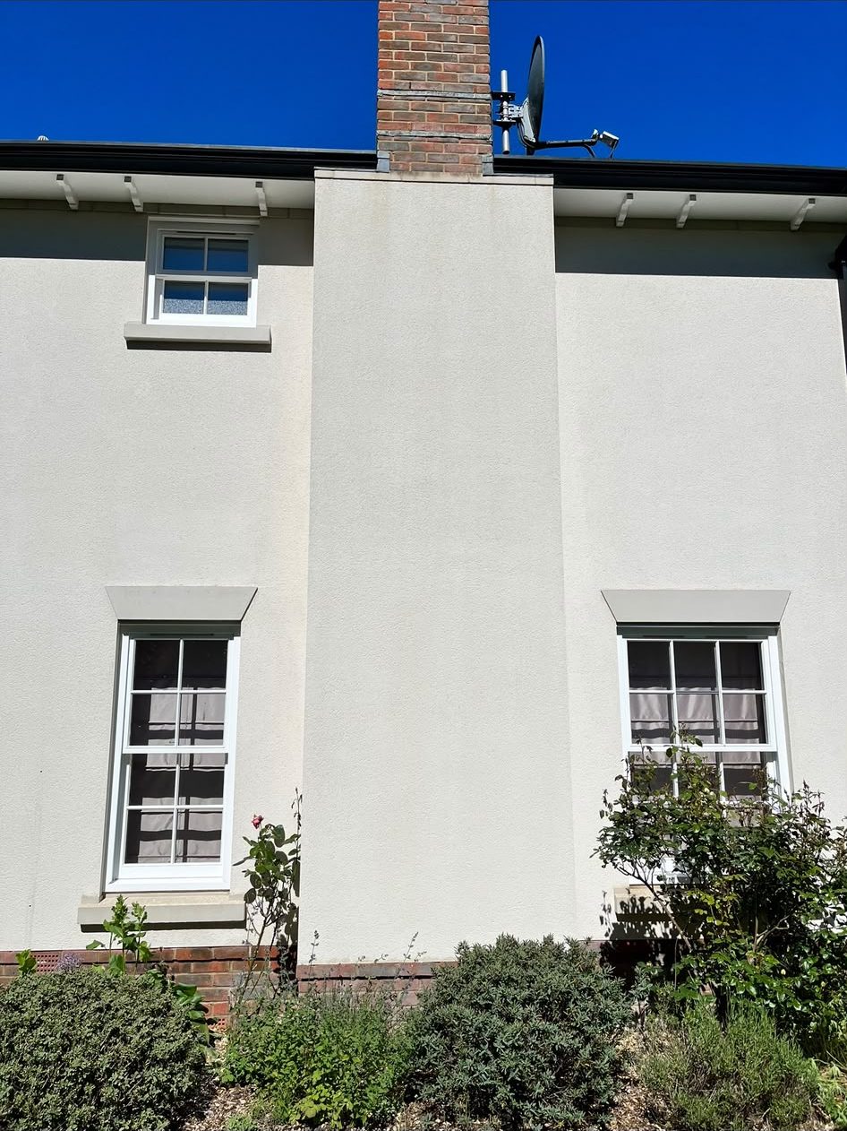 Rendered house wall after render cleaning in Lymington