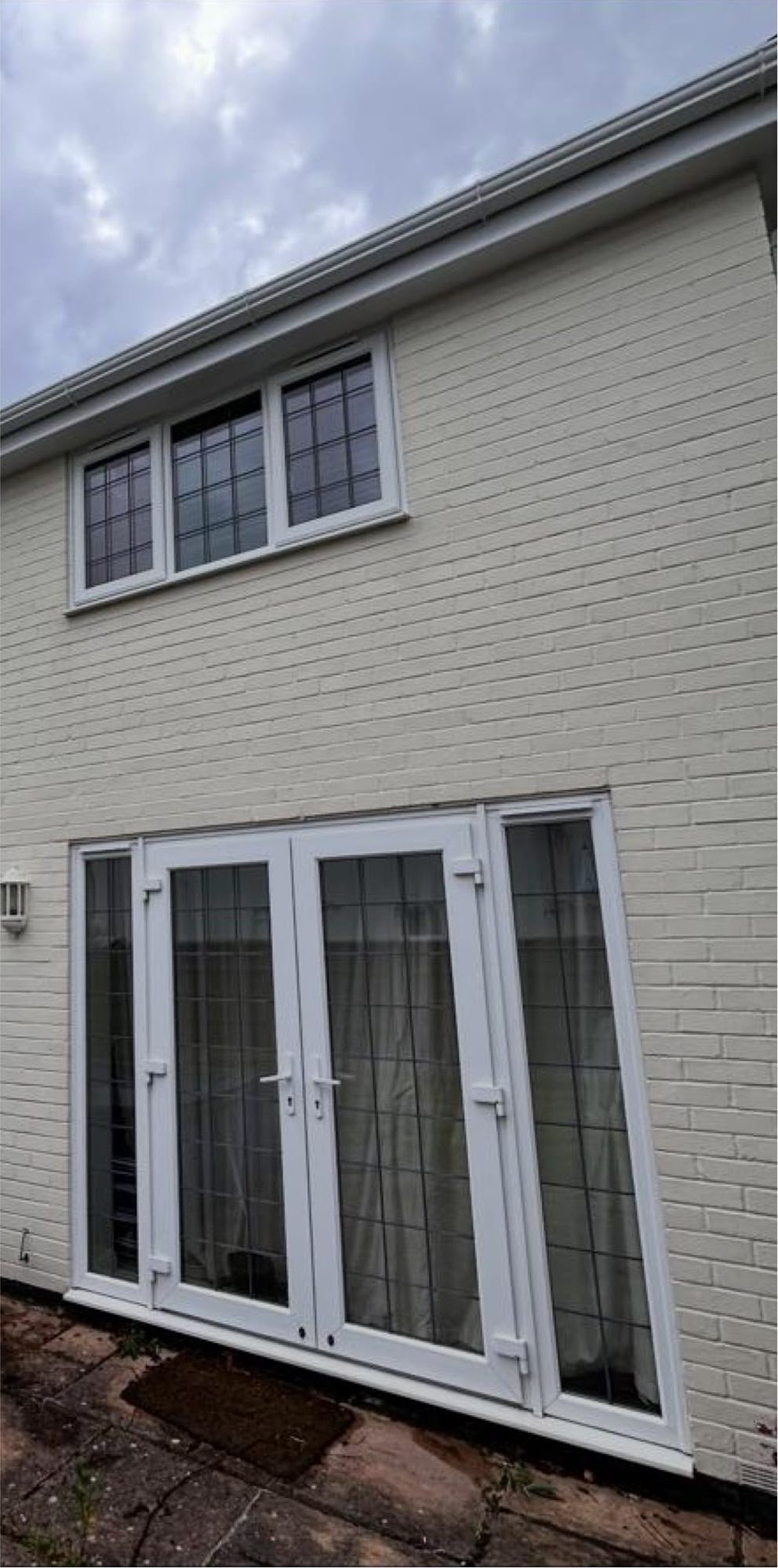 Soft washing before and after on painted brick walls in Lymington - after