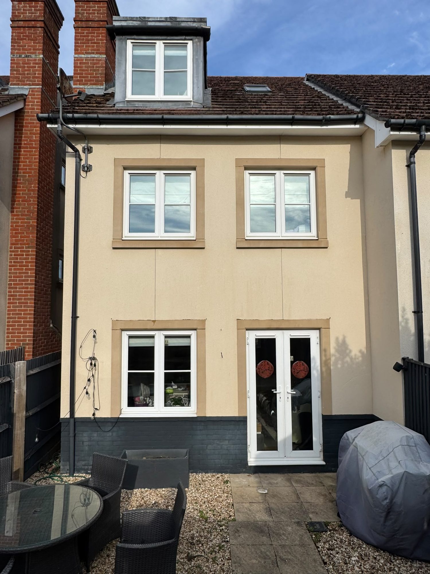 Rendered house wall after render cleaning in Lymington