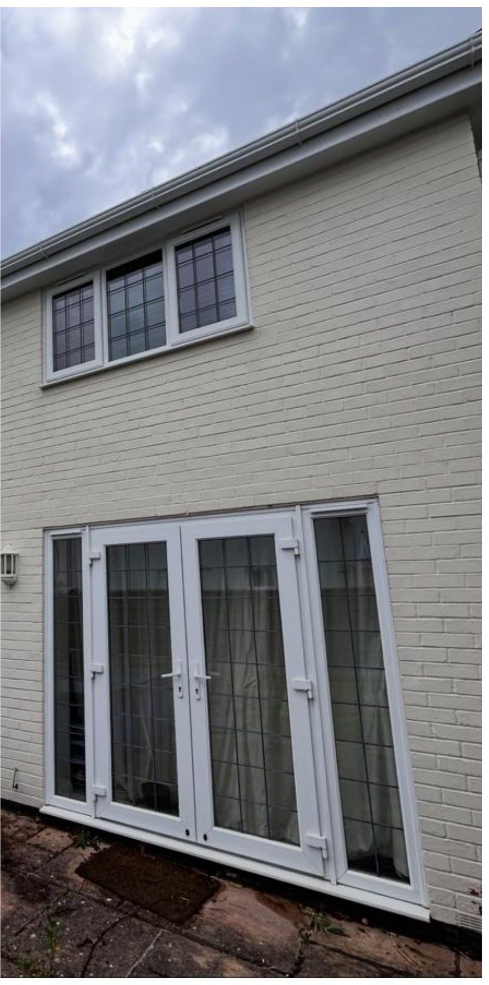 Window cleaning after with a water-fed pole on a two-storey home in Lymington