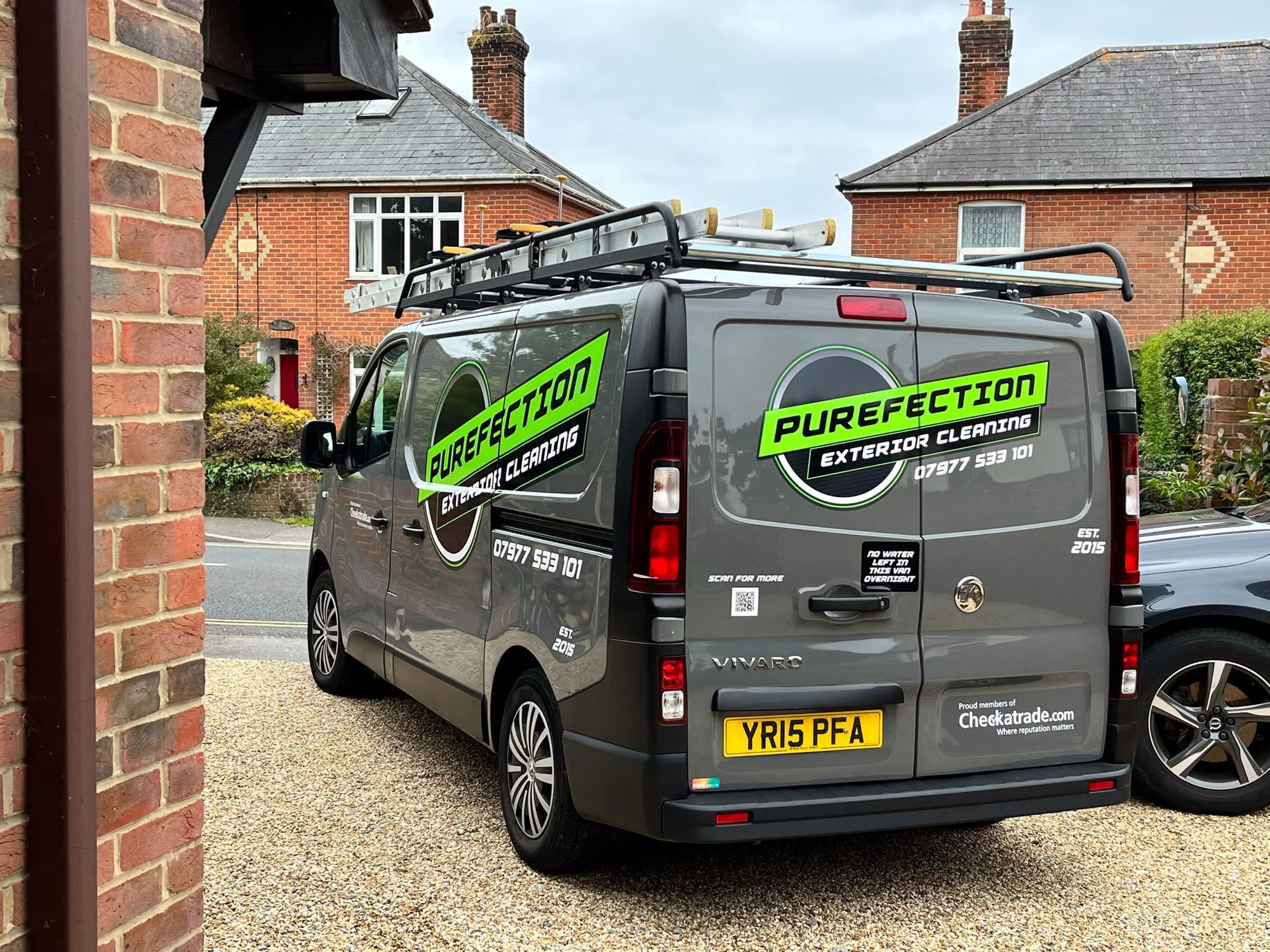 Purefection Exterior Cleaning van outside a customer's property