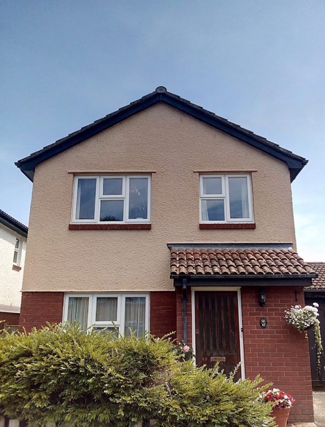 Rendered house wall after render cleaning in Lymington