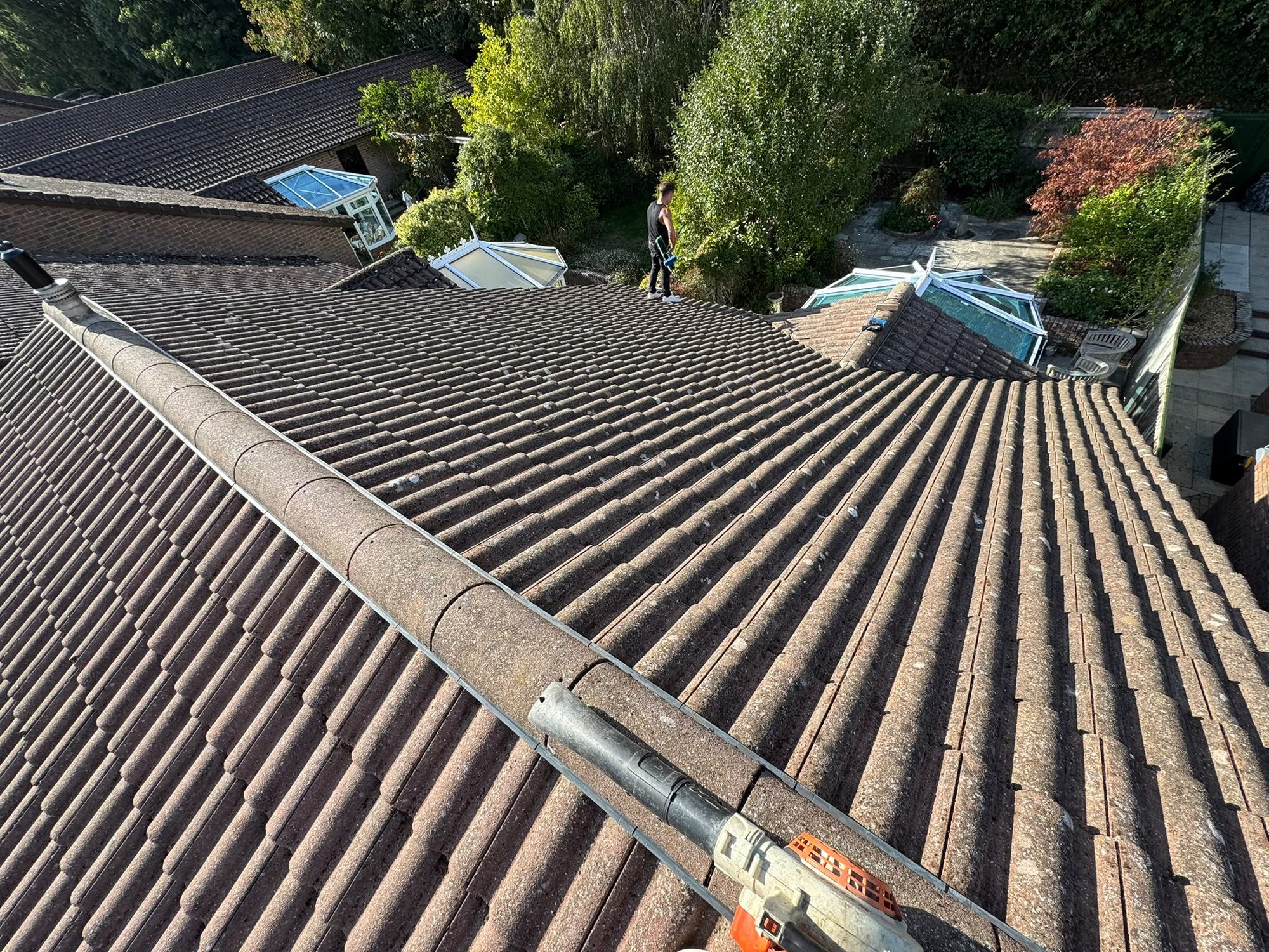 Tiled roof being cleaned by Purefection in Lymington
