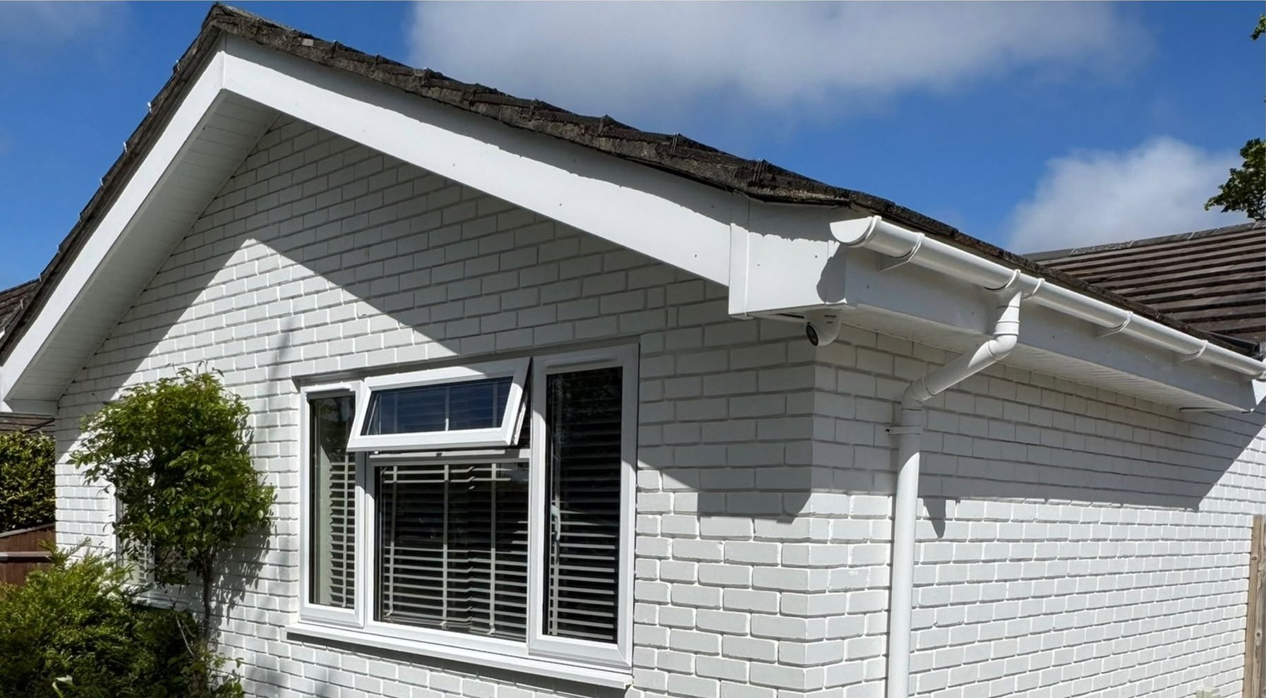 Gutter, fascia and soffit cleaning before and after on a white bungalow in Lymington - after