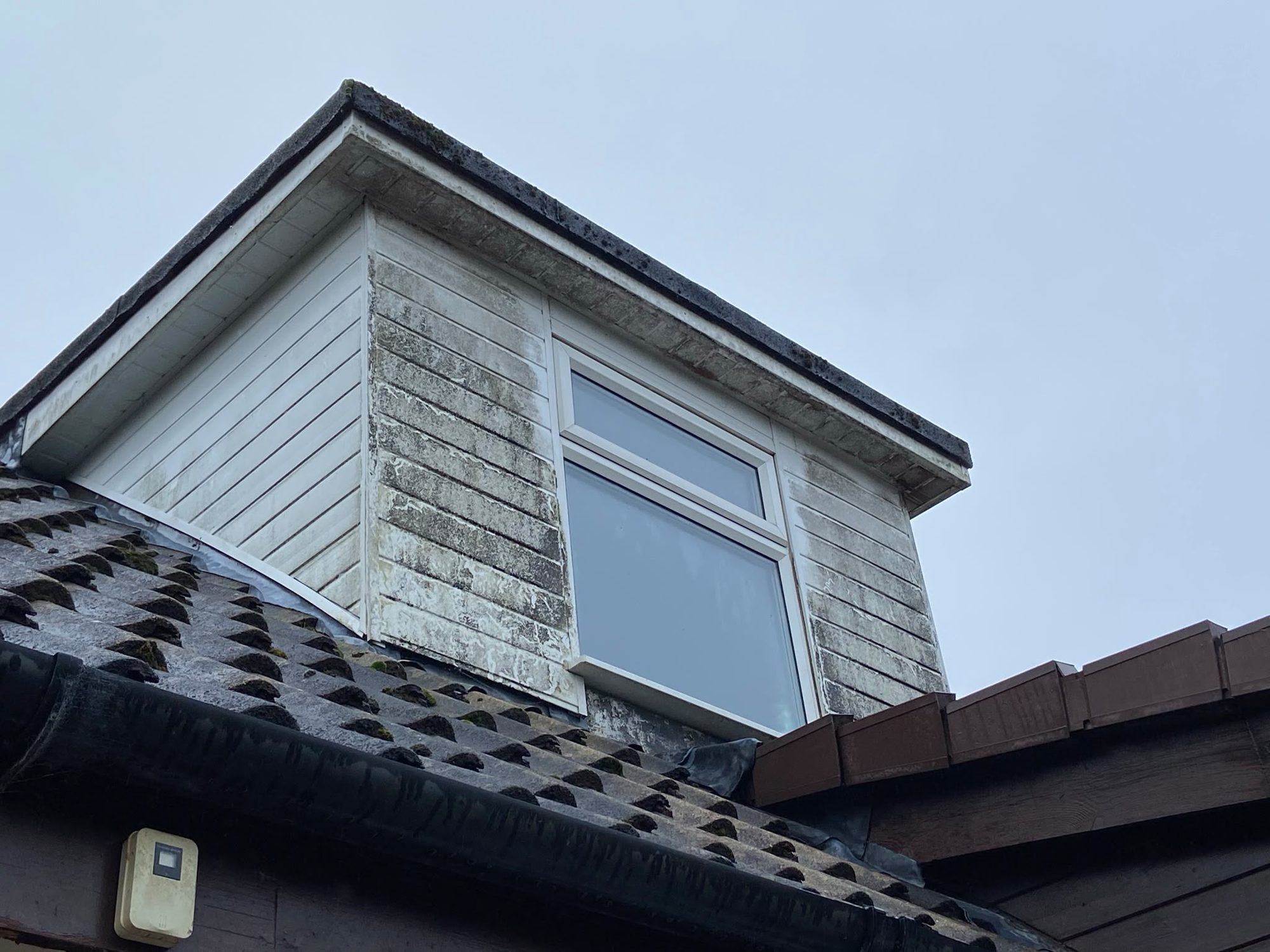 UPVC dormer cladding soft washed before and after in Lymington - before